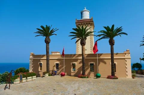 Lighthouse and palm trees on a seaside terrace in Tangier, Morocco Фото