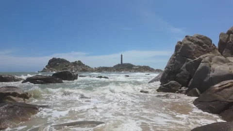 Lighthouse And Rocks Stock Footage 313267109