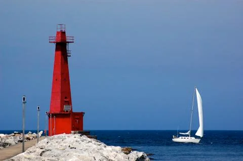 Lighthouse and sailboat, Muskegon, MI Stock Photos