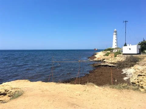 Lighthouse and the sea Stock Photos