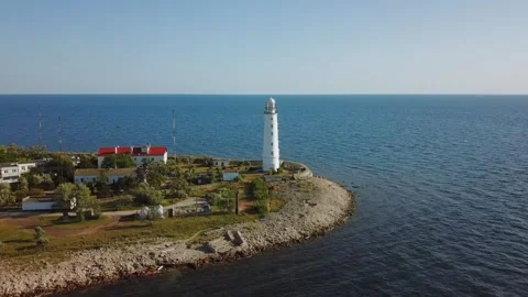 Lighthouse and seascape at summer sunny day in Stock Footage 299680646