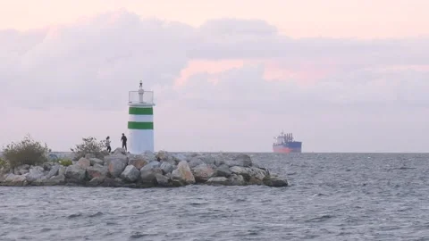 Lighthouse and the ship in the evening Stock Footage 218987917
