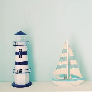 Lighthouse and ship model for decorated in room with retro filter effect 스톡 사진
