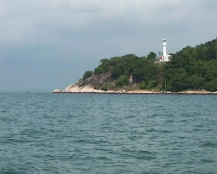 Lighthouse and speedboat Stock Footage 115996
