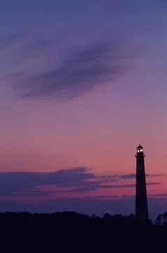Lighthouse and sunset Stock Photos