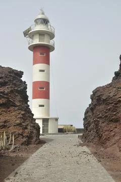 The lighthouse and the volcano Stock Photos