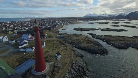 Lighthouse Andennes Norway circling orbit descending aerial Stock Footage