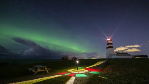 Lighthouse with Aurora Borealis and night sky Stock Footage 250757019
