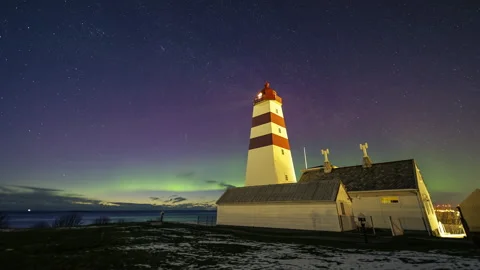 Lighthouse with Aurora Borealis and starry sky Stock Footage 250756472