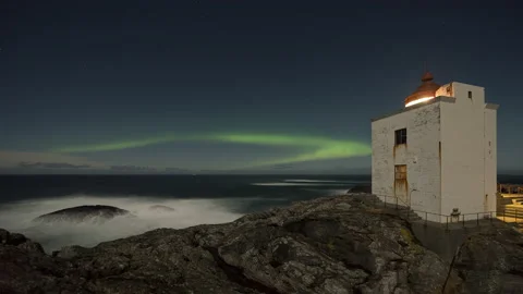 Lighthouse with aurora borealis on coast Stock Footage 147432460