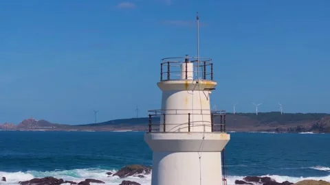 Lighthouse Backdropped By Wind Turbines Stock Footage 271537472
