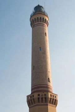 Lighthouse on a background of blue sky Stock Photos