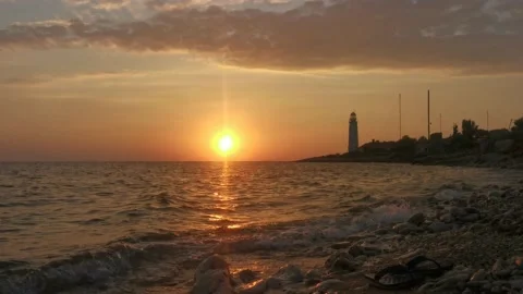 A lighthouse on the background of an orange sunset Video stock 152277179