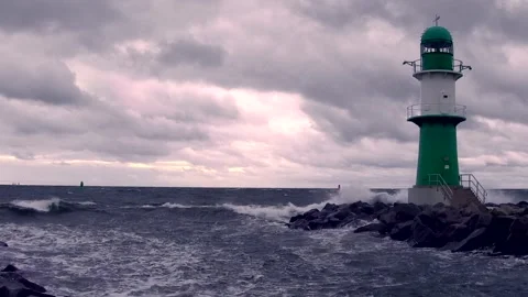 Lighthouse on baltic sea - storm, ocean, sprays, waves, clouds, wind - real time Stock Footage 141142740