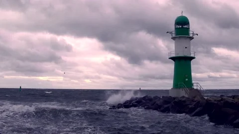 Lighthouse on baltic sea - storm, ocean, sprays, waves, clouds, wind - real time Stock Footage 141145505