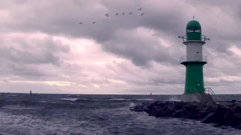 Lighthouse on baltic sea - storm, ocean, sprays, waves, clouds, wind - real time Stock Footage 141146129