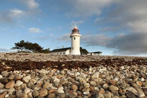 Lighthouse beach coast Stock Photos