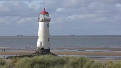 Lighthouse Beach Dog Walkers Stock Footage 127306946