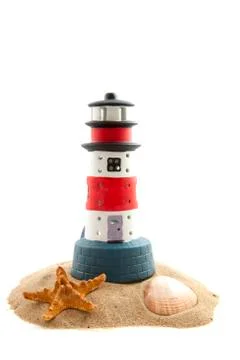 Lighthouse on the beach Stock Photos