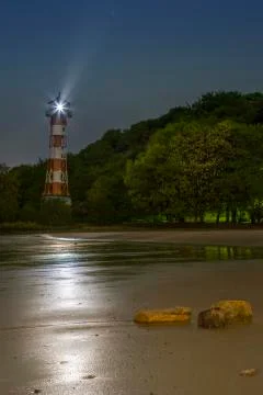 Lighthouse at the Beach Stock Photos