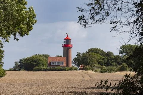 Lighthouse behind a cornfield on a summer day, Germany, Island Fehmarn Stock Photos