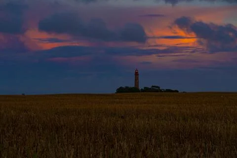 Lighthouse behind a cornfield at sunset. Germany, Island Fehmarn Stock Photos