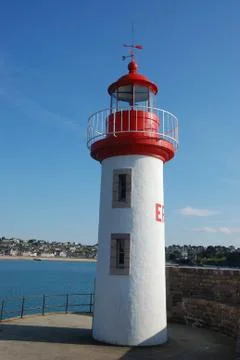 Lighthouse on a blue sky Stock Photos