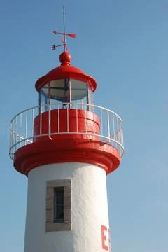 Lighthouse on a blue sky Stock Photos