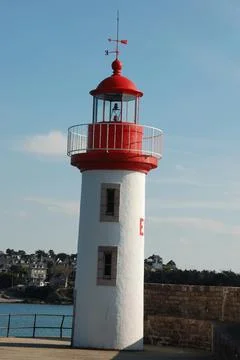 Lighthouse on a blue sky Stock Photos