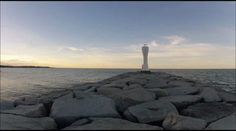 Lighthouse on breaker; timelapse with panning Stock Footage 32728026