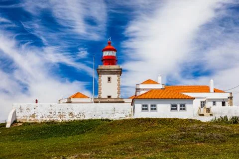 The lighthouse in Cabo da Roca. Cliffs and rocks on the Atlantic ocean coast  Stock Photos