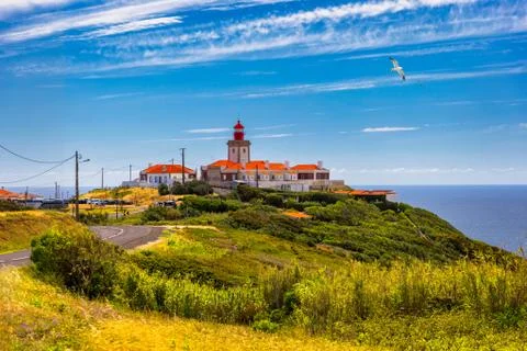 The lighthouse in Cabo da Roca. Cliffs and rocks on the Atlantic ocean coast  Stock Photos