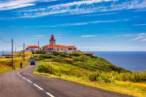 The lighthouse in Cabo da Roca. Cliffs and rocks on the Atlantic ocean coast  Stock Photos