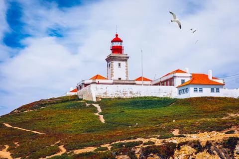 The lighthouse in Cabo da Roca. Cliffs and rocks on the Atlantic ocean coast  Stock Photos