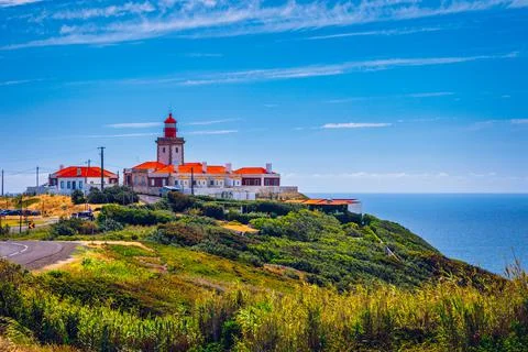 The lighthouse in Cabo da Roca. Cliffs and rocks on the Atlantic ocean coast  Stock Photos