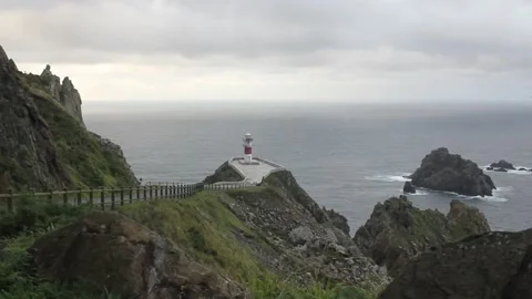 Lighthouse in Cape Ortegal in a windy day Stock Footage 250293864