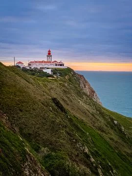 Lighthouse of Cape Roca or Cabo da Roca, Portugal, on high cliff at colorful Stock Photos