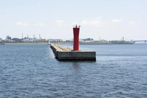 Lighthouse on cement structure in harbour of Kobe Japan Stock Photos