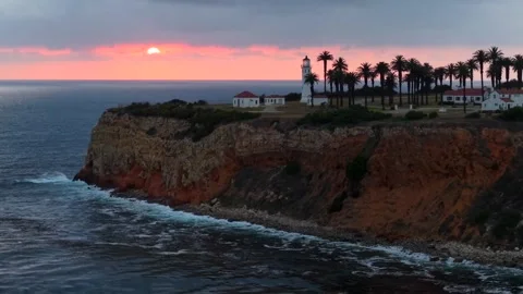 Lighthouse on a Cliff During Sunset Stock Footage 340579605