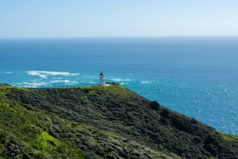 Lighthouse on a Cliff Overlooking the Ocean Stock Photos