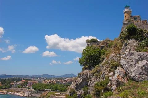 Lighthouse on a cliff Stock Photos