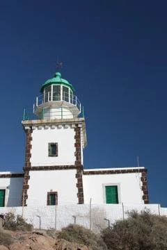 Lighthouse on a cliff Stock Photos