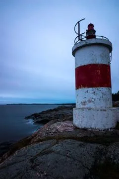 Lighthouse on cliff Stock Photos