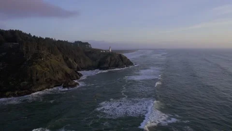 Lighthouse on a Cliff at Sunset Stock Footage 190733685