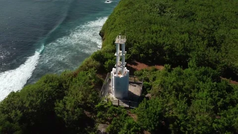 Lighthouse on clifftop above ocean Stock Footage 154228420