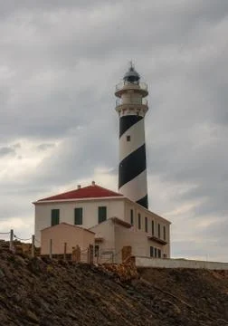 Lighthouse on a cloudy day. Far de Favaritx. Favaritx lighthouse in Menorca, Spa Foto stock
