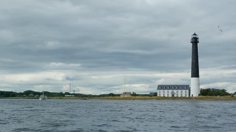 Lighthouse on a cloudy day over the sea boat Saaremaa Sõrve Säär 2019.07.13 Vídeos de archivo 115030254