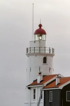 Lighthouse on a cloudy day Stock Photos