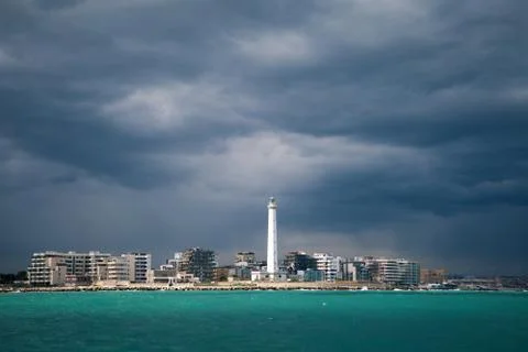 Lighthouse in a cloudy day with a storm approaching Stock Photos