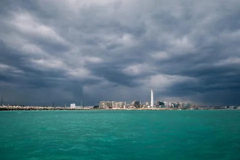 Lighthouse in a cloudy day with a storm approaching Stock Photos